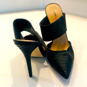 Black leather slip on high heel with two large straps and an open back